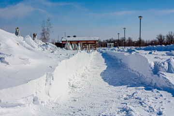 Snow-covered roads and sidewalks in the city center. Snow removal. Soft Focus