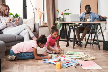 Creative kids drawing while having an art therapy at home