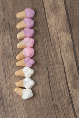 Pink and white icecream shape jellybeans on the table