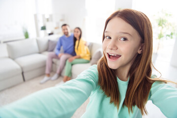 Fototapeta premium Photo of young attractive cheerful girl happy positive smile make selfie with mom dad family weekend home