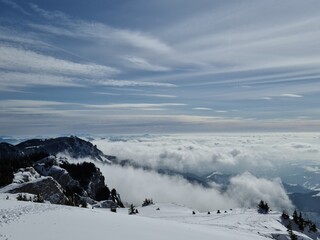Snow covered mountains and a sea of clouds