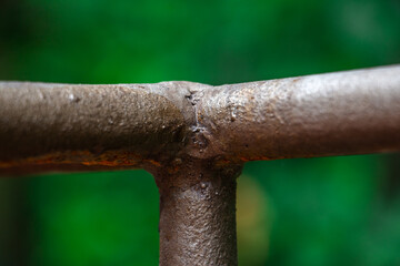 Rust damage paint and corrosion flange on the roof tank. plumbing iron pipes, industry, manufacture...