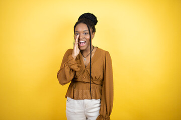 African american woman wearing casual clothes shouting and screaming loud to side with hands on mouth