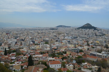 View of the cityscape of Athens with Mount Lycabettus in the distance from the Acropolis of Athens, Greece
