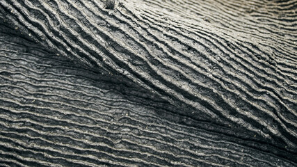 One of the first stages of production of rubber products at the plant. Close-up of raw material seam texture. Medium wholesale manufacturing technology