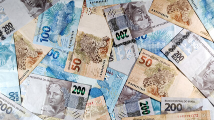 Fototapeta na wymiar various money notes of 50 reais 100 reais and 200 reais from brazil. money from brazil. earn money. Real, Currency, Money, Dinheiro, Reais, Brasil.