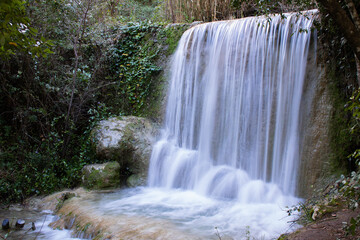 Long exposure of small cascade in nature. Quiaios Waterfall in Portugal, also known as Cascata de Quiaios near Figueira da Foz, a peaceful natural hidden place in the woods