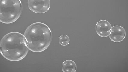 Shampoo bubbles floating like flying in the air by wind blow which represent refreshing playful...