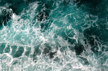 Fototapeta na wymiar Abstract blue sea water with white wave