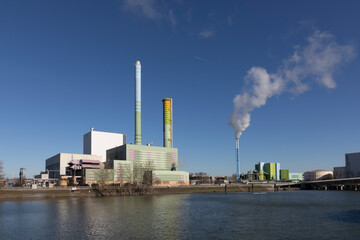 power station industry area with silos and tanks at the rhine harbor in Mainz-Mombach, Germany.