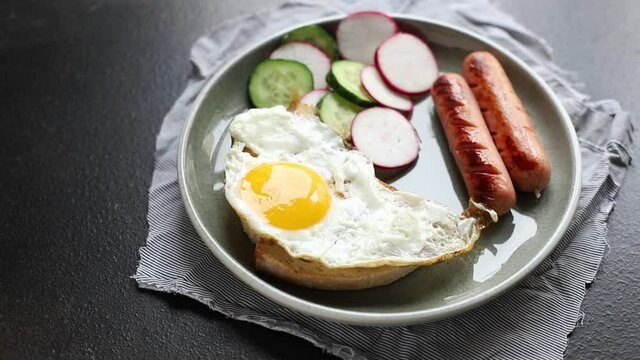 fried eggs breakfast vegetables, bread and sausages, eggs and bread bun croque-monsieur or croque-madam portion on the table cooking meal snack outdoor top view copy space for text food background