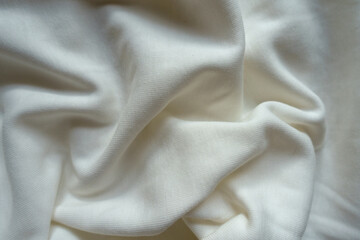 Jammed simple white cotton jersey fabric from above