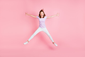 Full size photo of happy funky little girl jump up star shape dream isolated on pink color...