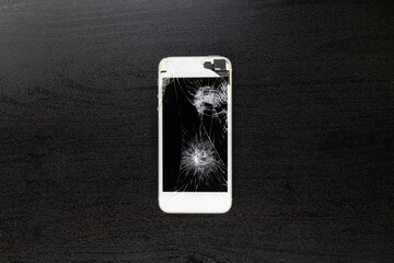 Screen cracked smartphone. Mobile phone with damaged touchscreen. Repairing smartphone. Replacing broken screen.