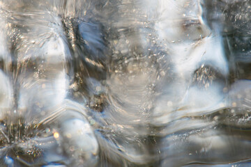 Close-up colorful horizontal photo of icicle. Macro picture of ice for background or texture