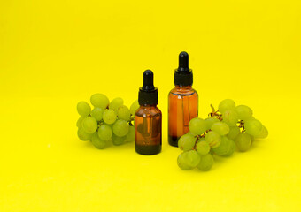 Pure essential oil for skin care. The concept of alternative medicine or spa treatment Organic cosmetics on yellow background. Space for text. Selective focus