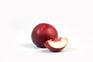 Ripe whole nectarine peach fruit with half and slice isolated on white background. Peaches with clipping path