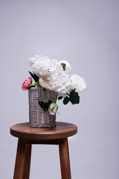 Artificial Flowers In Woven Basket