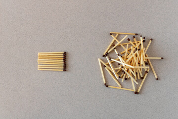Lots of matches on a light background. The concept of chaos and order. Selective focus.