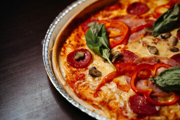 pizza with salami and tomatoes