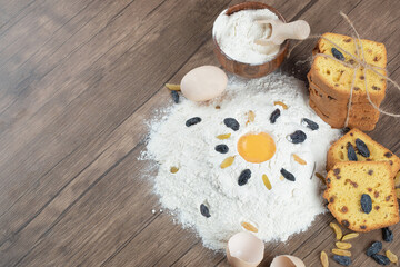 Pie slices with ingredients on a wooden desk