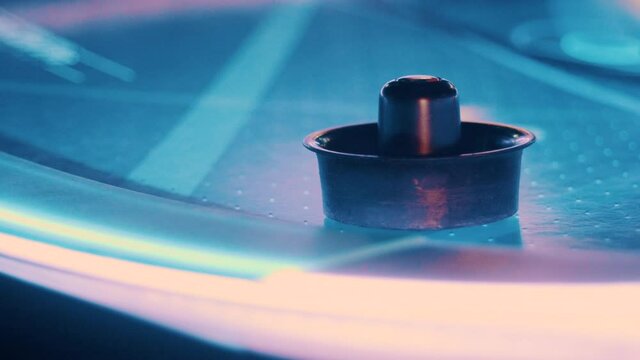 Air hockey table lighting up with lights.