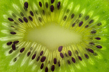 Fresh juicy kiwi slice macro close up. Kiwi fruit texture wallpaper