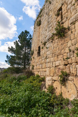 Fototapeta na wymiar The outer walls of the ruins of crusader Fortress Chateau Neuf - Metsudat Hunin is located at the entrance to the Israeli Margaliot village in the Upper Galilee in northern Israel