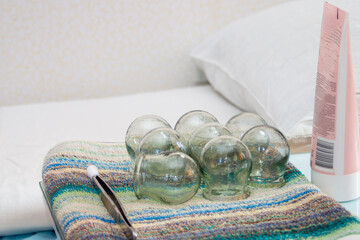 Therapeutic massage jars are prepared for work