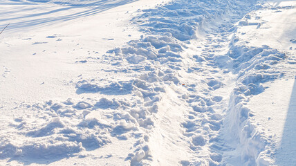 snowy winter road in a winter field