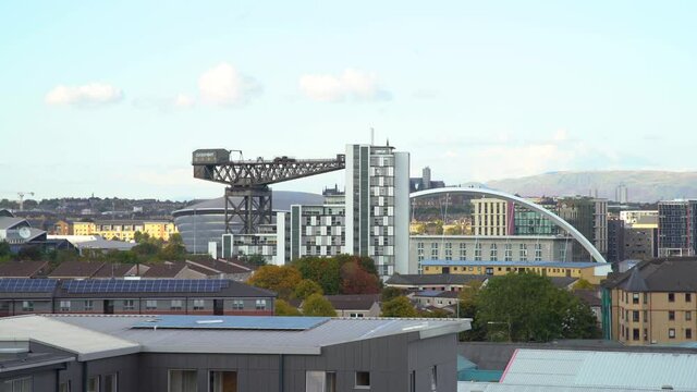 Aerial wide static of Glasgow's Armadillo, Finnieston Crane and Squinty Bridge from afar
