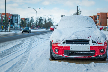 Fototapeta premium Car parked on winter snow road in town in england uk during covid lockdown