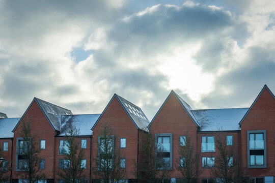 New built terraced houses under snow in england uk