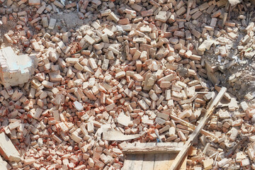 Debris on building demolition or explosion site, view from above.