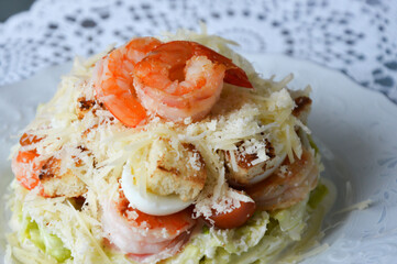 delicious fresh caesar salad with shrimps. delicious food. background for the design.