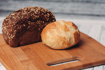 loaf of bread on a wooden board powerful products food