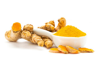 The powdered turmeric is in a white ceramic cup with fresh turmeric placed outside isolate on white background.