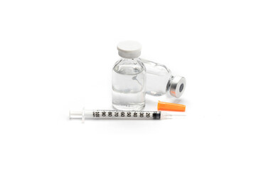 Close up medical or vaccine vial for injection with a syringe isolate on white background.