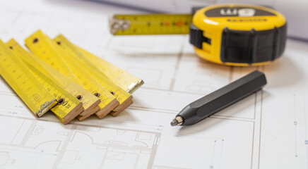 Residential building drawings and pencil on an office desk. Construction concept.