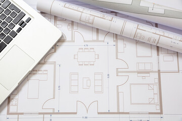 Architect engineer office desk. Drawings and computer laptop