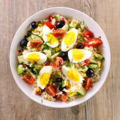 vegetable salad with rice, tomato, cucumber and egg