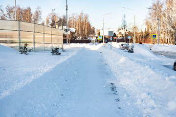 Moscow. Russia. February 2021. Cleared the snow from the paths after a huge snowfall. Deep walking paths in Moscow.