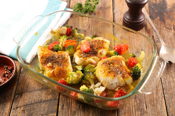 fish fillet with spices and vegetables