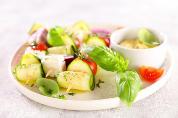 Kebabs, vegetarian on skewer with dipping sauce