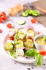 vegetable skewer with courgette,  cherry tomato, onion and cheese feta with dipping sauce