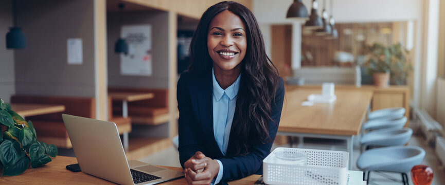 Confident Young African American Businesswoman Working In An Office Lounge