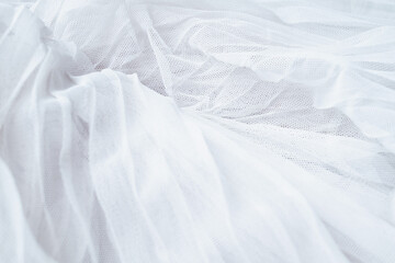 Obraz premium White colored tulle fabric texture. Textile background