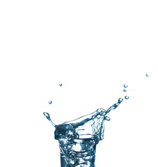 Splash in a glass on white isolated background Vodka on an old wooden table as detailed close-up shot. Transparent glass with liquid. Hand over glass