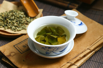 Lotus leaf tea in blue and white porcelain covered bowl