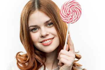 attractive woman with lollipop in hands sweets emotions joy closeup